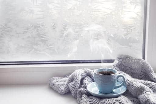 Hot coffee by a cold window