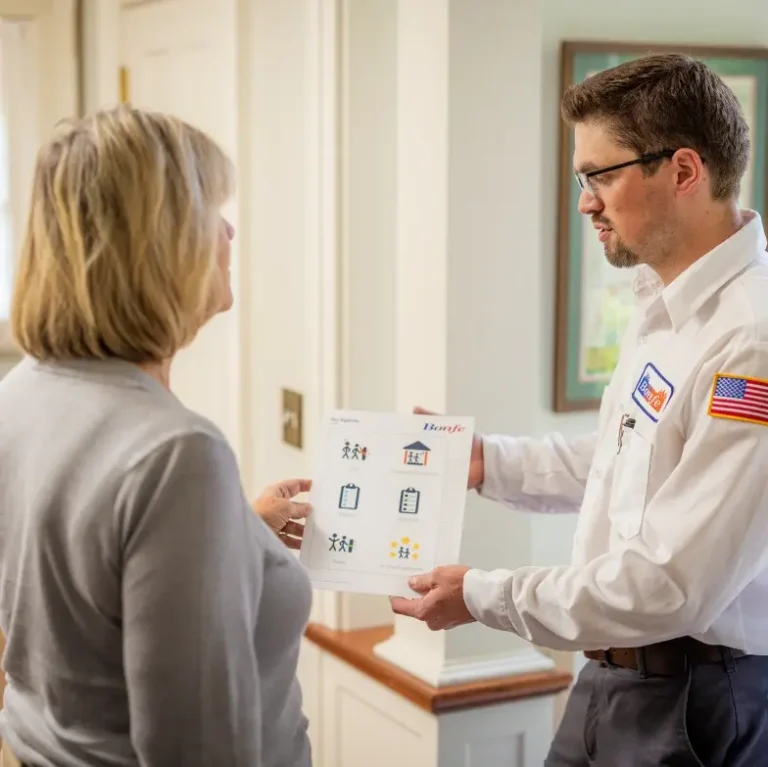 Heating Tech from Bonfe working with homeowner showing options