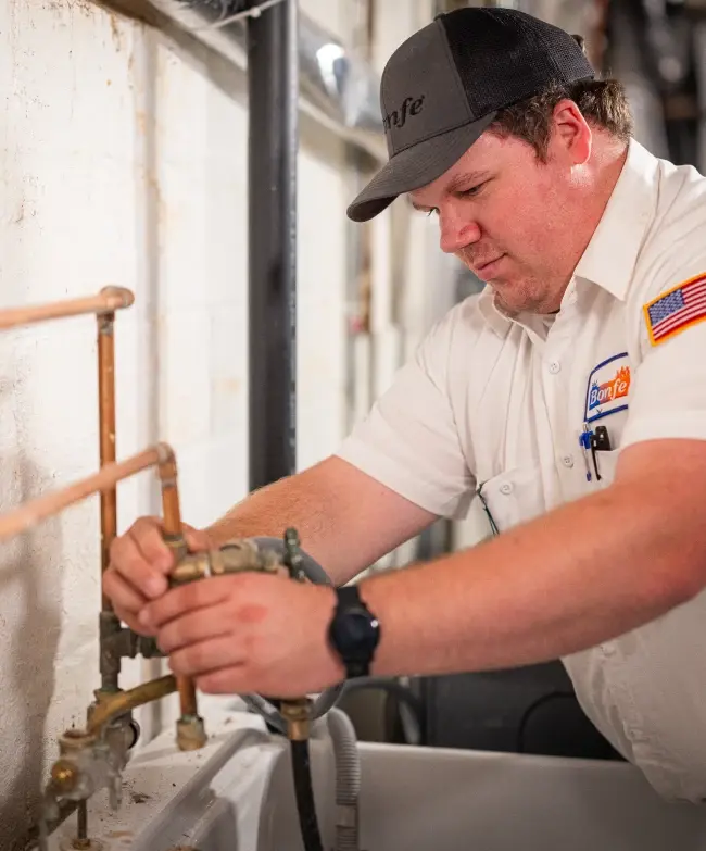 Bonfe Plumbing Tech working on home plumbing issues